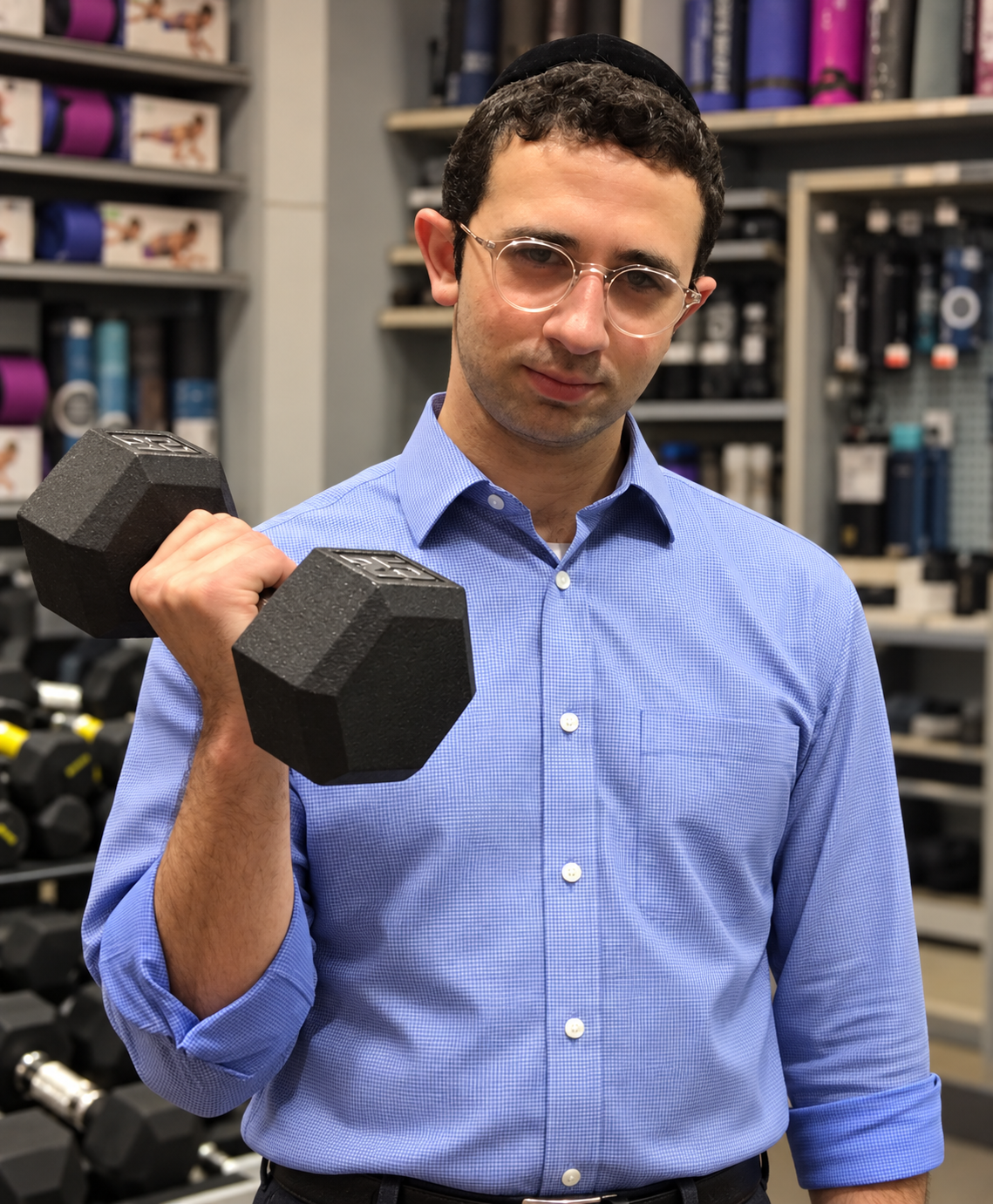 Alan Richard Reid lifting a large black dumbbell